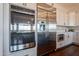Stainless steel oven and refrigerator with white cabinetry and modern backsplash at 28304 N 141St Way, Scottsdale, AZ 85262