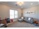 This bedroom features large windows, plush carpet, and a comfortable sitting area for relaxing and unwinding at 28304 N 141St Way, Scottsdale, AZ 85262