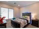 Cozy bedroom with dark wood bed frame and plaid comforter at 28304 N 141St Way, Scottsdale, AZ 85262