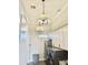 Bright laundry room with modern lighting, front load machines, and ample cabinet storage at 28304 N 141St Way, Scottsdale, AZ 85262