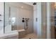 Sleek walk-in shower with frameless glass door and bench seating at 28304 N 141St Way, Scottsdale, AZ 85262