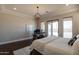Comfortable main bedroom with desk, white board, and access to outdoor area at 28304 N 141St Way, Scottsdale, AZ 85262
