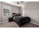 Bedroom with plush carpet, natural light, a comfortable bed, and simple decor at 30071 W Indianola Ave, Buckeye, AZ 85396