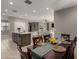 Open-concept dining room showcasing seamless flow into the kitchen and living area at 30071 W Indianola Ave, Buckeye, AZ 85396