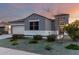 Charming single-story home showcasing a well-maintained front yard with desert landscaping and a decorative gate at 30071 W Indianola Ave, Buckeye, AZ 85396