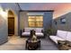 Cozy outdoor patio featuring comfortable seating around a modern fire pit, perfect for entertaining at 30071 W Indianola Ave, Buckeye, AZ 85396