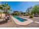 Relax by the pool in this backyard oasis with desert landscaping at 303 W Thompson Pl, Chandler, AZ 85286