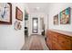 Inviting entryway with tiled floors and decorative artwork leading into the home at 3202 N 197Th Ave, Buckeye, AZ 85396