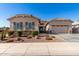 Charming single-Gathering home featuring a well-manicured front yard and a two-car garage at 3202 N 197Th Ave, Buckeye, AZ 85396