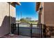 Charming front yard with iron gate and stone accents providing a welcoming view at 3202 N 197Th Ave, Buckeye, AZ 85396