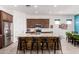Open kitchen featuring a spacious center island, modern appliances, and ample counter space at 3202 N 197Th Ave, Buckeye, AZ 85396