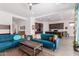 Open-concept living room with modern furnishings flowing into the kitchen at 3202 N 197Th Ave, Buckeye, AZ 85396