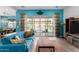 Cozy living room with large sliding doors that open to the backyard and pool at 3202 N 197Th Ave, Buckeye, AZ 85396