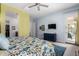 Bright main bedroom featuring light blue walls, stylish furniture, and carpeted floor at 3202 N 197Th Ave, Buckeye, AZ 85396