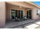 Cozy covered patio featuring comfortable seating, a ceiling fan, and seamless indoor-outdoor transition at 3202 N 197Th Ave, Buckeye, AZ 85396