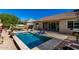 Inviting backyard pool and covered outdoor dining area, perfect for relaxing and entertaining at 3202 N 197Th Ave, Buckeye, AZ 85396