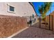 Functional side yard with gravel landscaping, a fenced-in area, and an AC unit enclosure at 3202 N 197Th Ave, Buckeye, AZ 85396