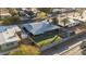 Aerial view of the property featuring a fenced-in backyard, covered patio, artificial turf, and a storage shed at 3834 E Shaw Butte Dr, Phoenix, AZ 85028