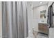 Cozy bathroom with patterned shower curtain, floating vanity and neutral color scheme at 3834 E Shaw Butte Dr, Phoenix, AZ 85028