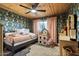 Charming bedroom with patterned wallpaper, a ceiling fan, and a large window at 3834 E Shaw Butte Dr, Phoenix, AZ 85028