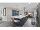 Bright kitchen with stainless steel appliances, large island with seating, and open floor plan at 3834 E Shaw Butte Dr, Phoenix, AZ 85028