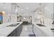 Bright kitchen with stainless steel appliances, island cooktop and seating and eat in dining area at 3834 E Shaw Butte Dr, Phoenix, AZ 85028