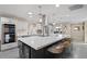 Bright, modern kitchen with large island, pendant lighting, stainless steel appliances and eat in dining area at 3834 E Shaw Butte Dr, Phoenix, AZ 85028