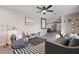 Bright and airy living room with an open layout, comfortable seating, and modern decor connecting seamlessly with the kitchen at 3834 E Shaw Butte Dr, Phoenix, AZ 85028