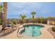 Backyard pool with desert landscaping and a comfortable seating area at 41573 W Anne Ln, Maricopa, AZ 85138