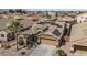 This house features solar panels, a tile roof, and low-maintenance desert landscaping, creating an energy-efficient and attractive home at 42660 W Oakland Dr, Maricopa, AZ 85138