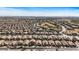 Aerial view of a Primary-planned community near a golf course at 42660 W Oakland Dr, Maricopa, AZ 85138