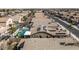 This aerial view captures the homes in the community with solar panels, pools, and well-maintained landscaping at 42660 W Oakland Dr, Maricopa, AZ 85138