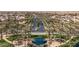 Aerial view of a manicured neighborhood entrance surrounded by palm trees at 42660 W Oakland Dr, Maricopa, AZ 85138