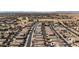 A neighborhood aerial shot, featuring a golf course nearby at 42660 W Oakland Dr, Maricopa, AZ 85138
