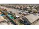 Stunning aerial view of a residential area featuring private pools and well-maintained tile roofs in a planned community at 42660 W Oakland Dr, Maricopa, AZ 85138