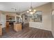 Well-equipped kitchen with stainless steel appliances, island seating, and an open layout for entertaining guests at 42660 W Oakland Dr, Maricopa, AZ 85138