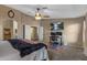 Large main bedroom featuring carpet floors, a ceiling fan, and a desk area for your office needs at 42660 W Oakland Dr, Maricopa, AZ 85138