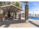 Charming pavilion with stone columns overlooking the lake and fountain offering a relaxing community gathering spot at 42660 W Oakland Dr, Maricopa, AZ 85138