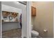 This closet conveniently connects to a half bathroom, enhancing functionality and privacy for homeowners at 42660 W Oakland Dr, Maricopa, AZ 85138