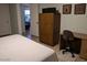 Bedroom featuring a bed, desk, and closet at 459 S Boojum Way, Mesa, AZ 85208