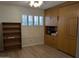 Bedroom featuring a spacious layout with wood floors, window with blinds, and built in storage at 459 S Boojum Way, Mesa, AZ 85208