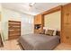 Versatile room with a murphy bed and built-in shelves, perfect for a guest room or a home office at 459 S Boojum Way, Mesa, AZ 85208