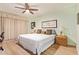Comfortable bedroom with a ceiling fan, a double bed, and light-colored walls for a relaxing ambiance at 459 S Boojum Way, Mesa, AZ 85208