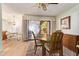Cozy dining area with wood floors, a round wooden table, and a ceiling fan at 459 S Boojum Way, Mesa, AZ 85208