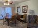 Dining room with wood table, chairs, and view of outside at 459 S Boojum Way, Mesa, AZ 85208