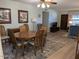 Bright dining area featuring wood table and neutral accents with view into Living Room at 459 S Boojum Way, Mesa, AZ 85208
