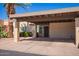 Beige house with a carport and desert landscaping featuring a cactus at 459 S Boojum Way, Mesa, AZ 85208