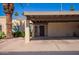 Home exterior showcasing desert landscaping, a covered entry and driveway, and a well-maintained façade at 459 S Boojum Way, Mesa, AZ 85208