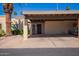 Tan house with a covered carport and desert landscaping for low maintenance at 459 S Boojum Way, Mesa, AZ 85208
