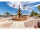 Community landmark of the Fountain of the Sun featuring well maintained landscaping with flags at 459 S Boojum Way, Mesa, AZ 85208